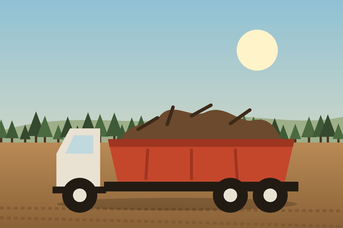 Dump truck loaded with brush and debris